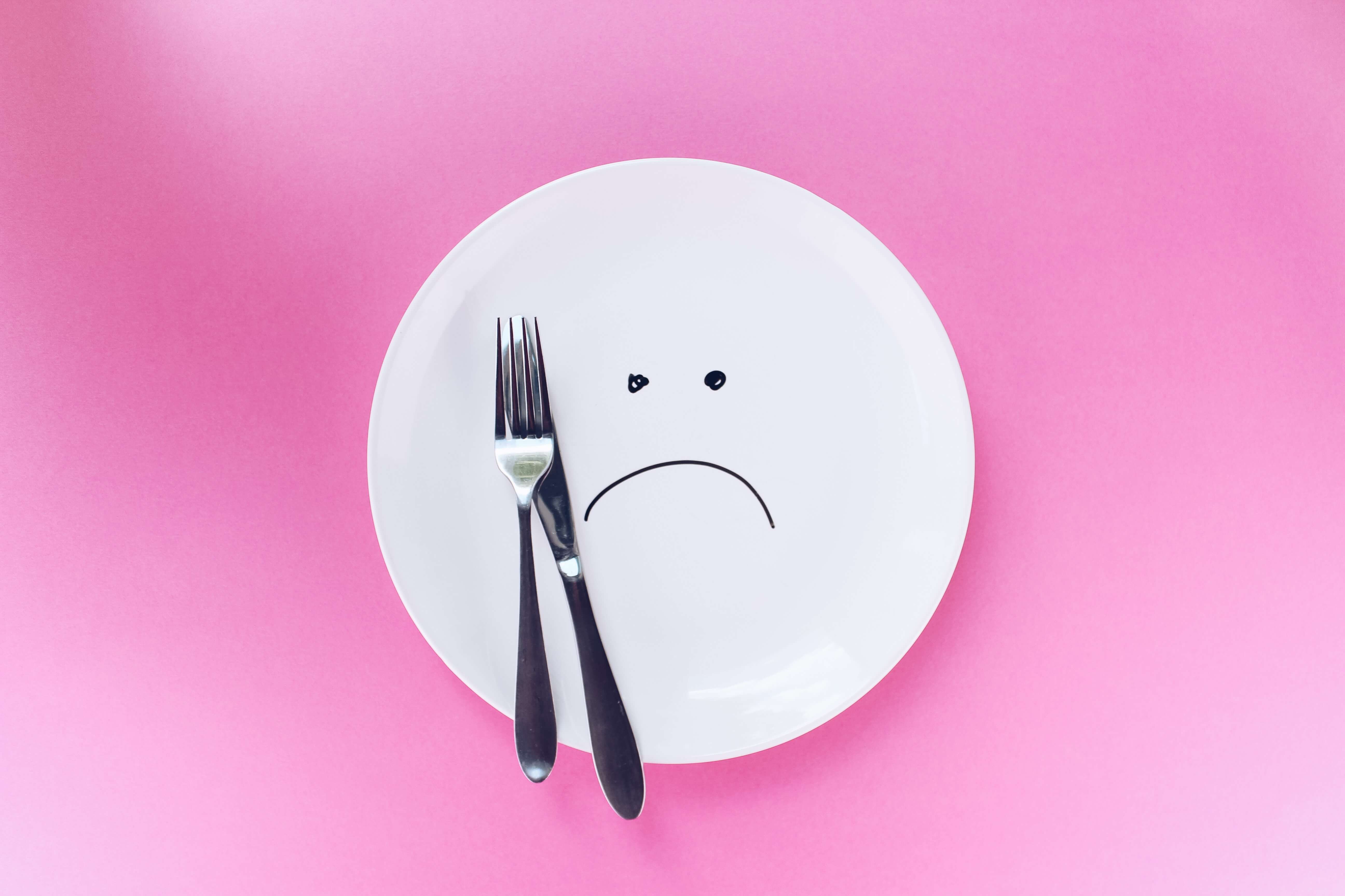 empty plate with frowning face